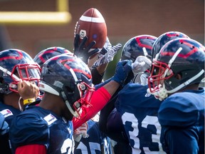 Players bond during Montreal Alouettes' spring training camp at Percival Molson Stadium in Montreal on Monday June 3, 2019.