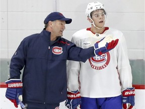 Montreal Canadiens 2018 first round draft choice Jesperi Kotkaniemi gets instructions from associate coach Kirk Muller during training camp practice at the Bell Sports Complex in Brossard on Sept. 14, 2018.