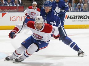 Canadiens' Tomas Tatar skates against Auston Matthews of the Toronto Maple Leafs at Scotiabank Place on Oct. 3, 2018, in Toronto. Tatar, a tradable commodity, escaped the NHL trade deadline bullet, but the Canadiens will miss the playoffs because the Leafs have Matthews and Montreal doesn't, Jack Todd writes.
