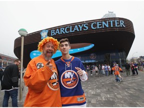 Fans arrive for NHL playoff game between the New York Islanders and Carolina Hurricanes at the Barclays Center in Brooklyn on April 26, 2019.
