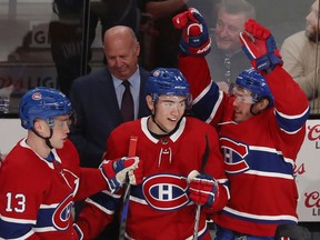Montreal Canadiens head coach Claude Julien looks on as Max Domi (13), Nick Suzuki (14) and Nick Cousins (21) celebrate a go-ahead goal by Shea Weber during third period against the New York Islanders on Dec. 3, 2019, in Montreal.