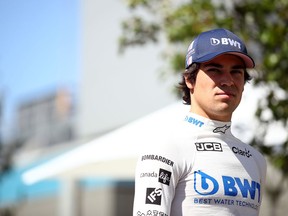 MELBOURNE, AUSTRALIA - MARCH 12: Lance Stroll of Canada and Racing Point looks on in the Paddock during previews ahead of the F1 Grand Prix of Australia at Melbourne Grand Prix Circuit on March 12, 2020 in Melbourne, Australia.
