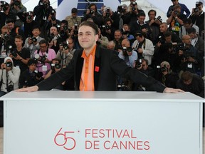 Xavier Dolan has premièred all but one of his eight films at Cannes, where he has become part of the contemporary lore. He's pictured at a photocall for Laurence Anyways in 2012.
