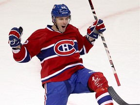 Canadiens' Mathieu Darche celebrates his against the New York Islanders in Montreal on  Dec. 13, 2011.