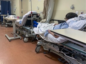 Patients in beds in the hallway in a Montreal emergency department in February 2020.
