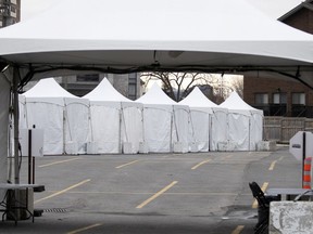 Rows of tents are set up at a new coronavirus screening clinic at the Cavendish Mall in Montreal, March 26, 2020.
