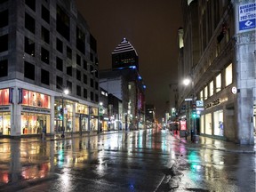 A near-empty Ste-Catherine St. at Peel is seen as the city deals with the coronavirus pandemic in Montreal, on Monday, March 30, 2020.