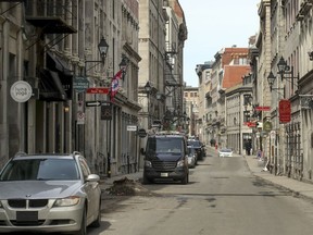 The sidewalks of Rue Saint-Paul in the heart of Old Montreal are empty Wednesday March 18, 2020 due to the coronavirus COVID-19 crisis.  (John Mahoney / MONTREAL GAZETTE) ORG XMIT: 64121 - 1304