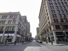 The corner of Peel and Ste-Catherine Sts. in the middle of the day in the heart of downtown Montreal March 18, 2020, in the midst of the coronavirus pandemic.