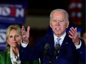 Democratic presidential hopeful former Vice President Joe Biden accompanied by his wife Jill Biden, speaks during a Super Tuesday event in Los Angeles on March 3, 2020. (Photo by Frederic J. BROWN / AFP)