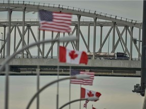 A truck crosses the Bluewater Bridge border crossing between Sarnia, Ont., and Port Huron, Mich., on March 16, 2020.