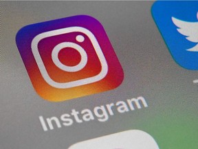 This file photo taken on October 1, 2019 in Lille shows the logo of mobile app Instagram displayed on a tablet.