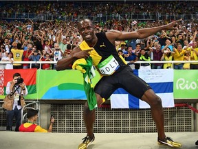Jamaica's Usain Bolt does his "Lightening Bolt" pose after Team Jamaica won the Men's 4x100m Relay Final during the athletics event at the Rio 2016 Olympic Games at the Olympic Stadium in Rio de Janeiro on August 19, 2016.