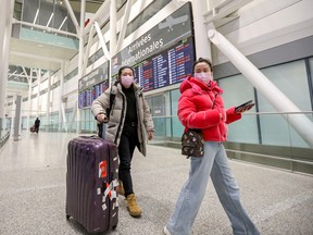 Travellers at Toronto's Pearson airport in January 2020.