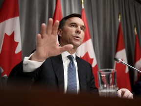 Finance Minister Bill Morneau speaks during a news conference on economic support for Canadians impacted by COVID-19 on March 18, 2020 at West Block on Parliament Hill in Ottawa.