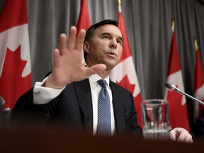 Finance Minister Bill Morneau speaks during a news conference on economic support for Canadians affected by COVID-19 on March 18, 2020 at West Block on Parliament Hill in Ottawa.