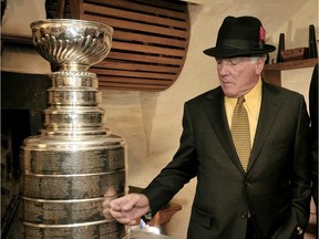 Former Montreal Canadien Henri Richard next to the  Stanley Cup in 2008.
