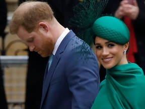 In this file photo Britain's Prince Harry, Duke of Sussex, and Meghan, Duchess of Sussex arrive at the annual Commonwealth Service at Westminster Abbey in London on March 09, 2020.