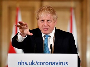 British Prime Minister Boris Johnson is seen during a news conference inside 10 Downing Street, London on March 19, 2020.