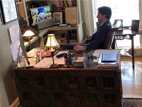 Canada's Prime Minister Justin Trudeau speaks with G7 leaders during a teleconference while under self-isolation, due to his wife Sophie Gregoire testing positive for novel coronavirus (COVID-19), in his home at Rideau Cottage in Ottawa, Ontario, Canada March 16, 2020. Prime Minister's Office/Handout via REUTERS    ATTENTION EDITORS - THIS IMAGE HAS BEEN SUPPLIED BY A THIRD PARTY. MANDATORY CREDIT.