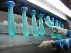 A worker performs a test on condoms at Malaysia's Karex condom factory in Pontian, 320 km southeast of Kuala Lumpur, on Nov. 7, 2012. Malaysia's Karex Industries is the world's largest condom maker by volume.