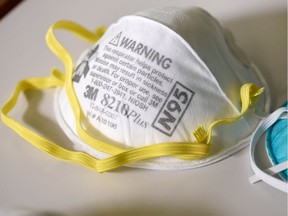 Various N95 respiration masks at a laboratory of 3M. Picture taken March 4, 2020.  REUTERS/Nicholas Pfosi