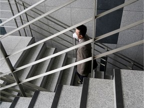 A professor of Pusan National University Park Hyun who used to be a coronavirus patient, walks up the stairs at Pusan National University in Busan, South Korea, March 30, 2020. REUTERS/Kim Hong-Ji