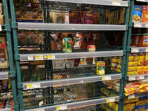 Shelves in a supermarket are cleared of canned goods amid coronavirus fears in New York, U.S., March 6, 2020.