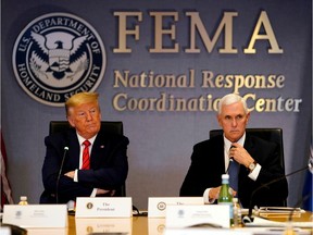 U.S. President Donald Trump and Vice President Mike Pence attend a teleconference with governors to discuss COVID-19 at the Federal Emergency Management Agency (FEMA) on March 19.