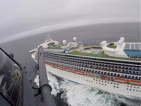 Airmen from the Moffett Federal Airfield based, 129th Rescue Wing deliver coronavirus test-kits to the Grand Princess cruise ship off the coast of California in this still image from a handout video obtained by Reuters on March 5, 2020.