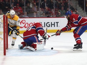 Canadiens goaltender Carey Price makes a save against Nashville Predators centre Matt Duchene as defenseman Shea Weber defends during the first period at Bell Centre on March 10.