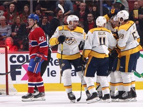 Predators players celebrate Calle Jarnkrok's goal in the second period as Canadiens' Lukas Vejdemo could only skate away Tuesday night at the Bell Centre.