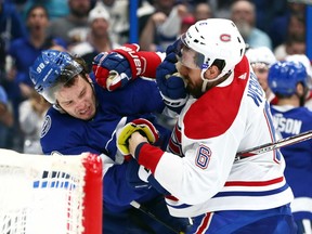 Lightning defenceman Mikhail Sergachev and Canadiens captain Shea Weber exchange blows during the second period at Amalie Arena in Tampa on March 5, 2020.