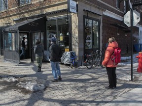 People observe 'social distancing' as they line up at a bakery on Monkland Avenue in N.D.G. in Montreal Thursday, March 16, 2020. Canada's public health agency's guide for provincial and local health authorities defines social distancing, trying to stay two metres away from other people, as steps to minimize close contact to prevent spreading of the coronavirus.