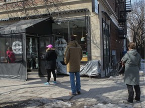 MONTREAL, QUE.: MARCH 19, 2020 -- People observe 'social distancing' as they line-up at an N.D.G. area bakery on Monkland Avenue in Montreal Thursday, March 16, 2020. Canada's public health agency's guide for provincial and local health authorities defines social distancing, trying to stay 2 metres away from other people, as steps to minimize close contact to prevent spreading of the coronavirus.