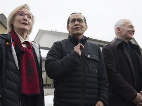 Wet'suwet'en hereditary leader Chief Woos, also known as Frank Alec, centre, Minister of Crown-Indigenous Relation, Carolyn Bennett, left, and B.C. Indigenous Relations Minister Scott Fraser arrive to address the media in Smithers, B.C., Sunday, March 1, 2020.