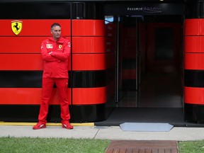 A team member stands outside the Ferrari garage at the Albert Park circuit in Melbourne.