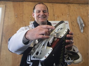 Quebec Finance Minister Eric Girard wipes his blade after skating on the eve of his budget speech, Monday, March 9, 2020 in Quebec City.