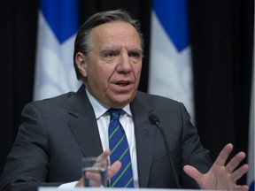 Quebec Premier François Legault responds to reporters' questions during a news conference on the COVID-19 pandemic, Wednesday, March 25, 2020 at the legislature in Quebec City.