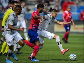 Montreal Impact forward Maximiliano Urruti (37) dribbles the ball past FC Dallas midfielder Thiago Santos (5) during the game between FC Dallas and the Montreal Impact at Toyota Stadium on Saturday, MArch 7, 2020.