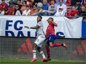 Impact forward Romell Quioto, left, and FC Dallas defender Reggie Cannon battle for the ball the ball during game at Toyota Stadium last Saturday.