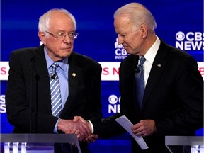 Democratic 2020 U.S. presidential candidates Senator Bernie Sanders shakes hands with former Vice President Joe Biden after the tenth Democratic 2020 presidential debate at the Gaillard Center in Charleston, South Carolina, U.S. February 25, 2020.