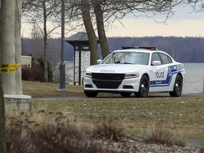 A police car patrols Dorval's Millennium Park on Wednesday, April 1. “We put signs in our parks: 'Don’t play on our playgrounds,' " says Dollard-des-Ormeaux Mayor Alex Bottausci. "But by all means, be our guests and go for a walk.”