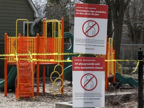 Signs block the entrance to the playground in Dixie Park in the Lachine borough of Montreal Wednesday April 1, 2020.  Parks and playgrounds have been closed since the outbreak of COVID-19. (John Mahoney / MONTREAL GAZETTE) ORG XMIT: 64193 - 3054