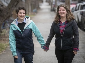 Mollie Witenoff (right) and Leah Dolgoy outside their home in Montreal on April 2, 2020. They were planning to get married on May 31, until the COVID-19 pandemic forced them to postpone the wedding until November.