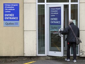 A man enters a COVID-19 clinic in Lachine April 3, 2020.