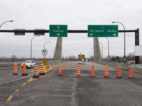 A security vehicle patrols the closed bridge leading to Ile Notre-Dame in Montreal, Quebec April 5, 2020.