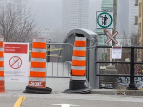 Barriers block the bridge leading to Atwater Market in Montreal on April 5, 2020.