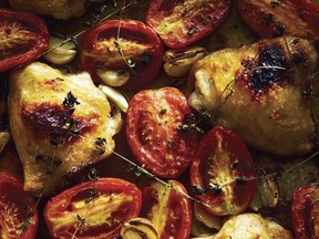 Broiled chicken thighs with plum tomatoes and garlic, from Dynamite Chicken by Tyler Kord.