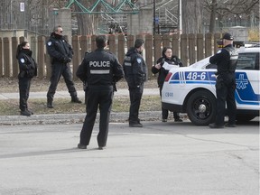 Montreal police practice social distancing while having a meeting at Lafontaine Park April 8, 2020.